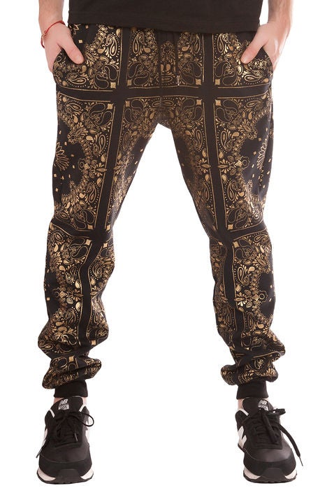 black and gold tiro pants